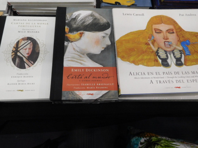 Emily Dickinson poetry in the mddle, Lewis Carroll's Alice in the Wonderland on the right